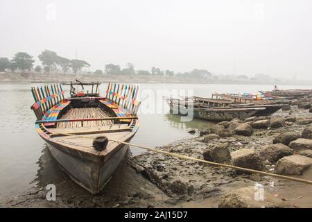 Boat floating over Brahmaputra river in Mymensingh Stock Photo