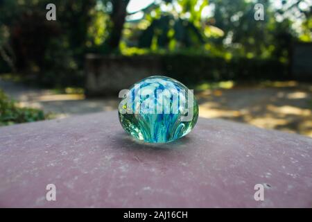Sunlight coming through glass ball in Bangladesh Stock Photo
