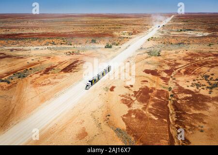 Road Trains with cattle on their way through the australian Outback. Stock Photo