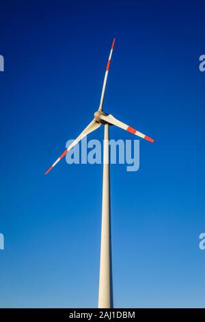 Juechen, North Rhine-Westphalia, Germany - Wind turbines against a blue sky. Juechen, Nordrhein-Westfalen, Deutschland - Windraeder vor blauem Himmel. Stock Photo