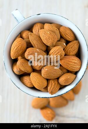 almonds on wooden surface Stock Photo