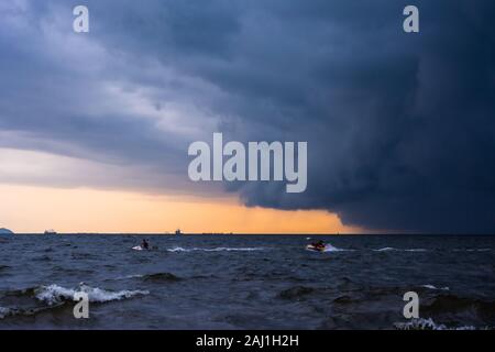 Approaching storm cloud with rain over the sea. Stock Photo