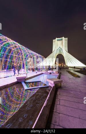 Azadi Tower or Borj-e Azadi tower or Freedom Monument formerly known as Shahyad Tower and cultural complex, Light tunnel at sunset, Tehran, Islamic Re Stock Photo