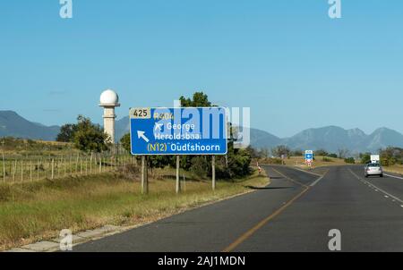 George, Western Cape, South Africa. December 2019. Airport control tower and road sign from the N2 highway Stock Photo