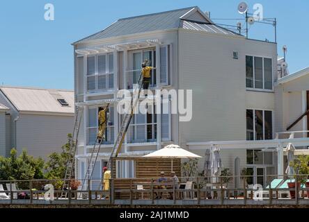 Knysna, Western Cape, South Africa. December 2019. Workmen painting a small hotel in early summer Stock Photo