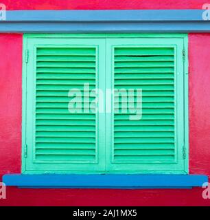 Colourful wooden window shutters. Stock Photo