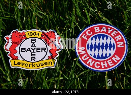 September 6, 2019, Munich, Germany. Emblems of German football clubs Bayer Leverkusen and Bayern Munich on the green lawn Stock Photo