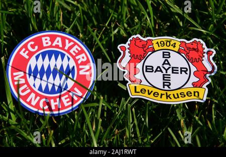 September 6, 2019, Munich, Germany. Emblems of German football clubs Bayer Leverkusen and Bayern Munich on the green lawn Stock Photo