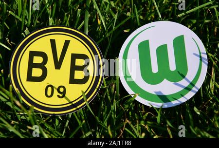 September 6, 2019, Munich, Germany. Emblems of German football clubs Borussia Dortmund and VfL Wolfsburg on the green lawn Stock Photo