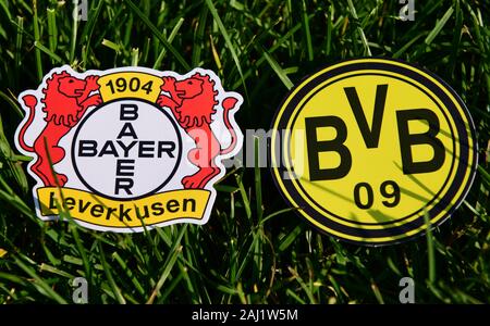 September 6, 2019, Munich, Germany. Emblems of German football clubs Bayer Leverkusen and Borussia Dortmund on the green lawn Stock Photo