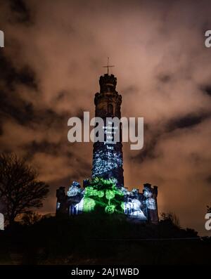 Edinburgh, UK. Wed 1st January 2020. The opening night of “Message from the Skies: Shorelines”, a collection of letters to Scotland reflecting on our relationship with our seas, waters and coasts and our maritime heritage. This projection is “Ten Thousand Miles of Edge” which takes place on the Nelson Monument on Calton Hill and features writer Robin Robertson, musician Alasdair Roberts and projections by Bright Side Studios. Robin Robertson’s “Ten Thousand Miles of Edge” takes us on a journey across Scotland’s vast island and coastal geography, incorporating personal reflections. Stock Photo