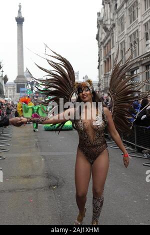 London, UK. 01st Jan, 2020. A dancer from London School of Samba takes part during the parade.The 34th year of London's New Year's Day Parade starts on the first day of 2020 with thousands of performers from all over the world. As one of the world's greatest street spectacular, each year, dancers, acrobats, cheerleaders, marching bands, historic vehicles and more assemble at the heart of the capital for a colourful celebration. Credit: SOPA Images Limited/Alamy Live News Stock Photo