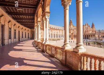 Under the arches of the semicircular Plaza de Espana, Maria Luisa Park, Seville, Andalusia, Spain, Europe Stock Photo