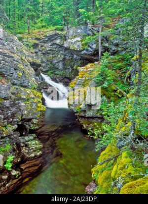 waterfall spilling into a gorge on the upper jocko river near arlee, montana Stock Photo