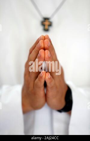 Close up of Monk's hands praying in church, Cistercian Abbey, Our Lady of My Ca, Vietnam, Indochina, Southeast Asia, Asia Stock Photo