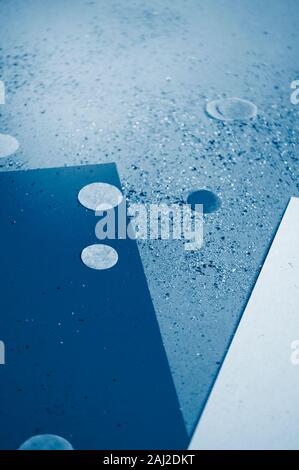 Blue confetti, sparkles on blue background. Festive background Stock Photo