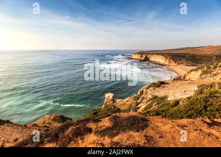 Beautiful winter sunny day with clear blue skies at Praia de Ribeira d'Ilhas located in Ericeira, 45 minutes away from Lisbon, known for great surfing Stock Photo