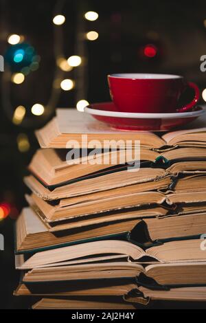 books and red cup of coffee with  croissant on Christmas  background Stock Photo