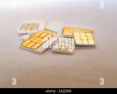 Many mini micro and nano sim cards for mobile telephone Stock Photo