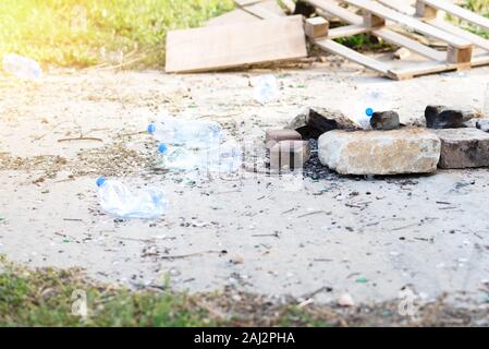 Plastic bottles on the park. Plastic Waste In The Nature. Trash left by tourists. Stock Photo