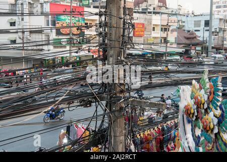 power lines at the mainroad at the Thai Border in the town of Mae Sai on the Border to Myanmar in the Chiang Rai Province in North Thailand.   Thailan Stock Photo