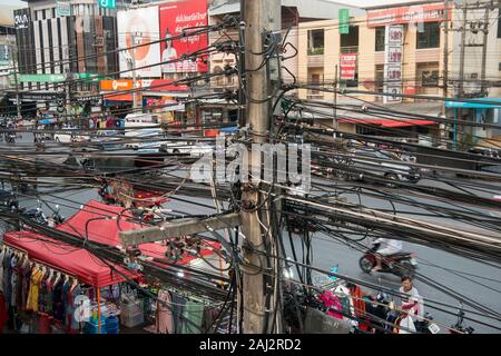 power lines at the mainroad at the Thai Border in the town of Mae Sai on the Border to Myanmar in the Chiang Rai Province in North Thailand.   Thailan Stock Photo