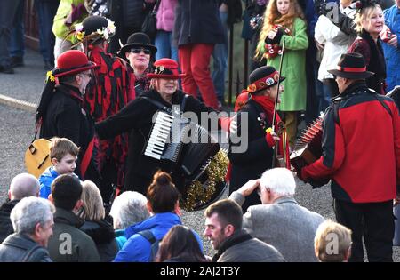 Having fun! The Ironmen & Severn Gilders dancing on the Ironbridge in Shropshire New Years Day 2020 Stock Photo