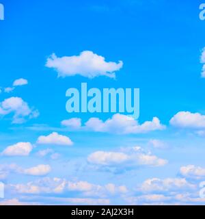 Blue sky with many white heap clouds, may be used as background Stock Photo