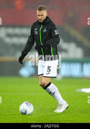 2nd January 2020; Liberty Stadium, Swansea, Glamorgan, Wales; English Football League Championship, Swansea City versus Charlton Athletic; Mike van der Hoorn of Swansea City warms up before the match  - Strictly Editorial Use Only. No use with unauthorized audio, video, data, fixture lists, club/league logos or 'live' services. Online in-match use limited to 120 images, no video emulation. No use in betting, games or single club/league/player publications Stock Photo