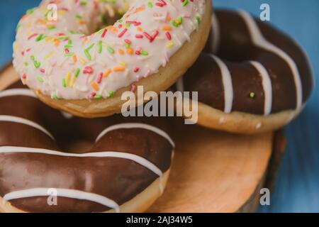 donuts lying on the table. blue background. Stock Photo
