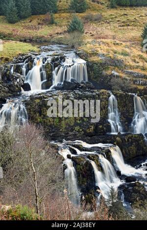 Loup of Fintry waterfall in central Scotland, UK. This is a 95 foot waterfall in 3 main sections. Portrait orientation. Stock Photo