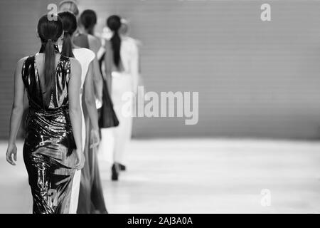 Fashion show, runway models on catwalk. Fashion week themed photograph. Stock Photo