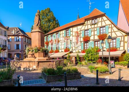 ALSACE WINE REGION, FRANCE - SEP 20, 2019: Restaurants and colorful houses on street of Ribeauville village which is located on Alsatian Wine Route, F Stock Photo