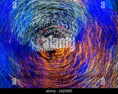 Twisted, colorful light streaks. Abstract chaotic background. Stock Photo