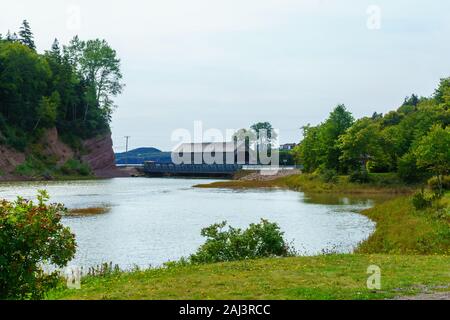 View of the covered bridge (#1) at high tide, in St. Martins, New Brunswick, Canada Stock Photo