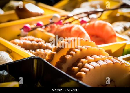 Osechi Ryori are traditional dishes enjoyed by Japanese people on New Year's day. Osechi are easily recognizable by their special boxes called jubako. Stock Photo