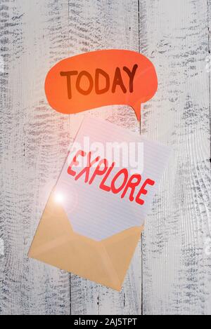 Text sign showing Explore. Business photo text Travel somewhere unknown to learn about it Examine Evaluate Front view open envelop speech bubble paper Stock Photo