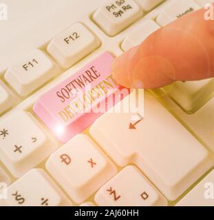 Text sign showing Software Development. Business photo text software is created using a specific programming Stock Photo
