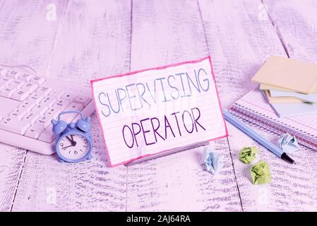 Word writing text Supervising Operator. Business photo showcasing monitoring and coordinating the plant operations Notepaper stand on buffer wire in b Stock Photo