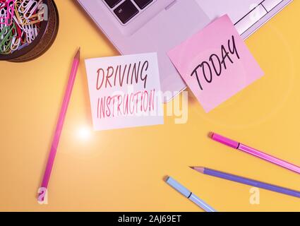 Conceptual hand writing showing Driving Instruction. Concept meaning detailed information on how driving should be done Laptop sticky notes container Stock Photo
