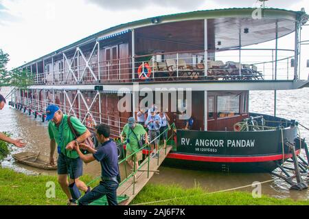 Red River Delta, Vietnam; November 12, 2015. Passengers on Pandaw cruise ship disembarking to visit a village in the Red River Delta. Stock Photo