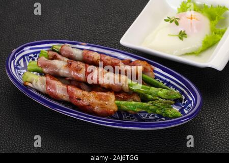 Asparagus with bacon and poached egg Stock Photo