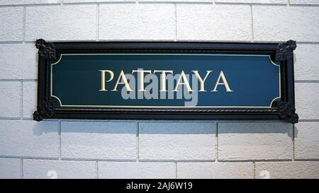 white wall sign frame pattaya city plaque green rusty Stock Photo