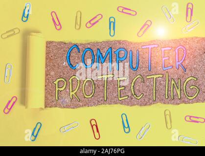 Text sign showing Computer Protecting. Business photo text protecting computer against unauthorized intrusions Paper clip and torn cardboard placed ab Stock Photo