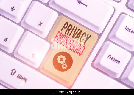 Writing note showing Privacy Engineering. Business concept for engineered systems provide acceptable levels of privacy Stock Photo