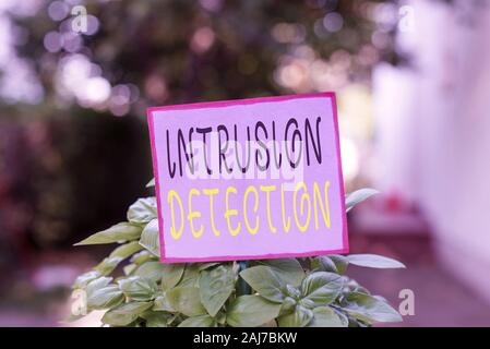 Conceptual hand writing showing Intrusion Detection. Concept meaning monitors a network or systems for malicious activity Plain paper attached to stic Stock Photo