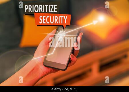 Handwriting text Prioritize Security. Conceptual photo designate security risk as more important to solve Stock Photo