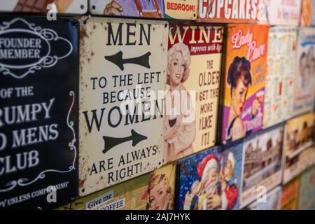 Old metal/enamelled 1940's style funny sign saying 'Men to the left..because Women are always right'. Stock Photo
