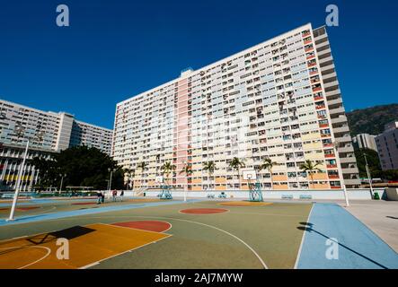 basketball court and rainbow colored building facade in HongKong - Stock Photo