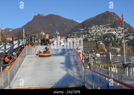 Lugano, Switzerland - 10 July 2016 - children who practice ice tubing at Lugano on Switzerland Stock Photo